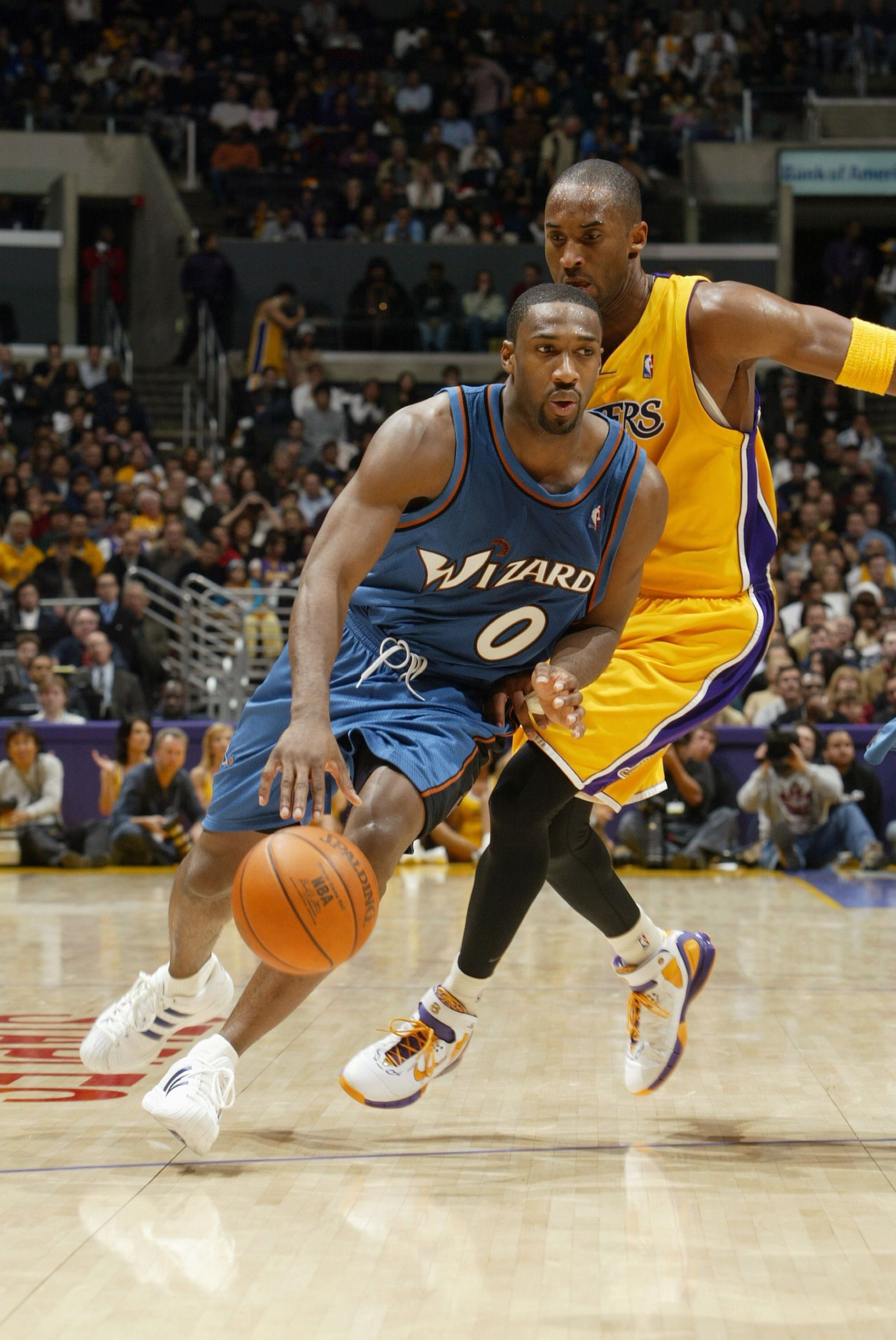 Gilbert Arenas of the Washington Wizards drives past Kobe Bryant of the LA Lakers during a game on Dec. 16, 2005, in Los Angeles, California.