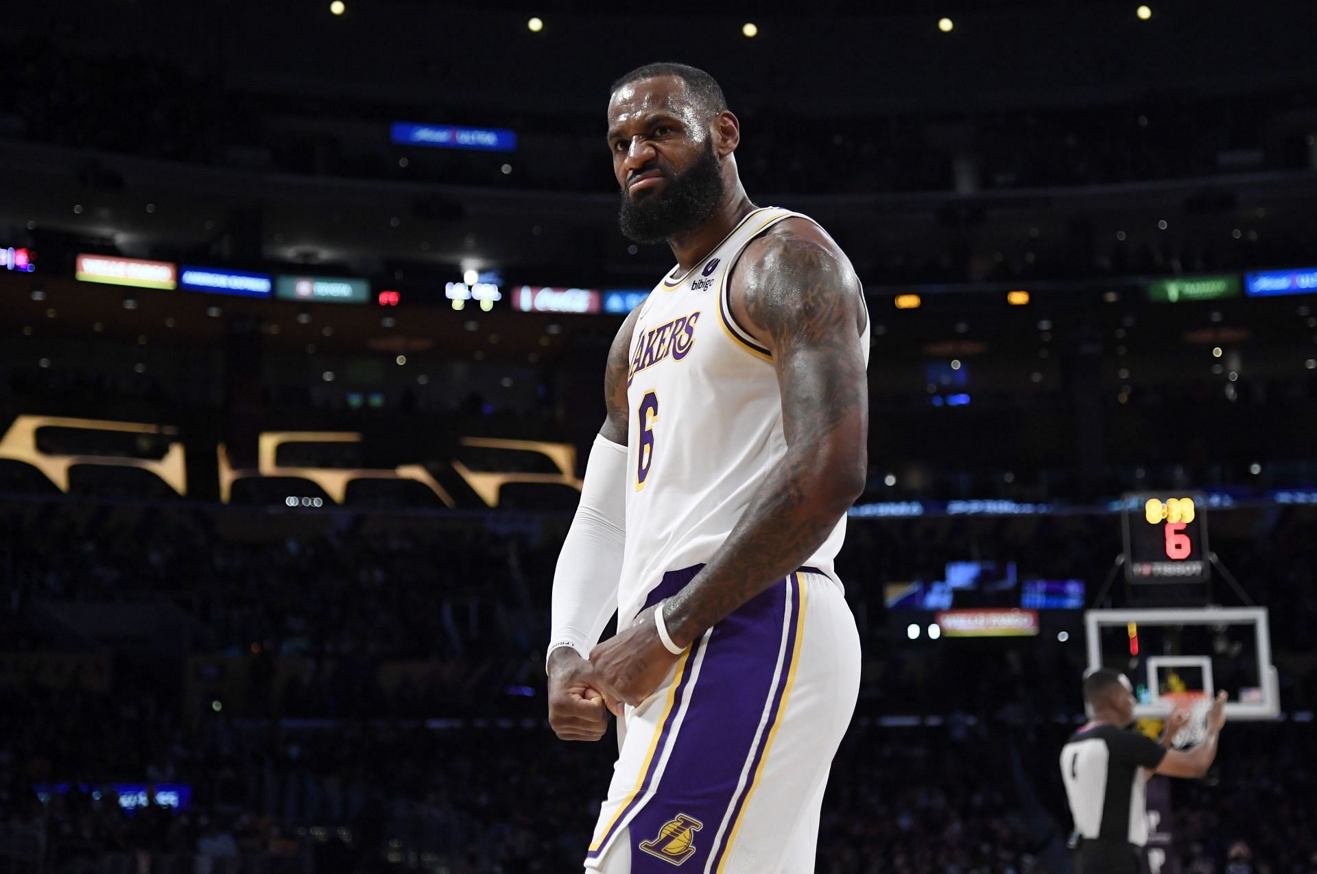 LeBron James #6 of the Los Angeles Lakers reacts after scoring a basket and drawing a foul against Orlando Magic during the first half at Staples Center on December 12, 2021 in Los Angeles, California.