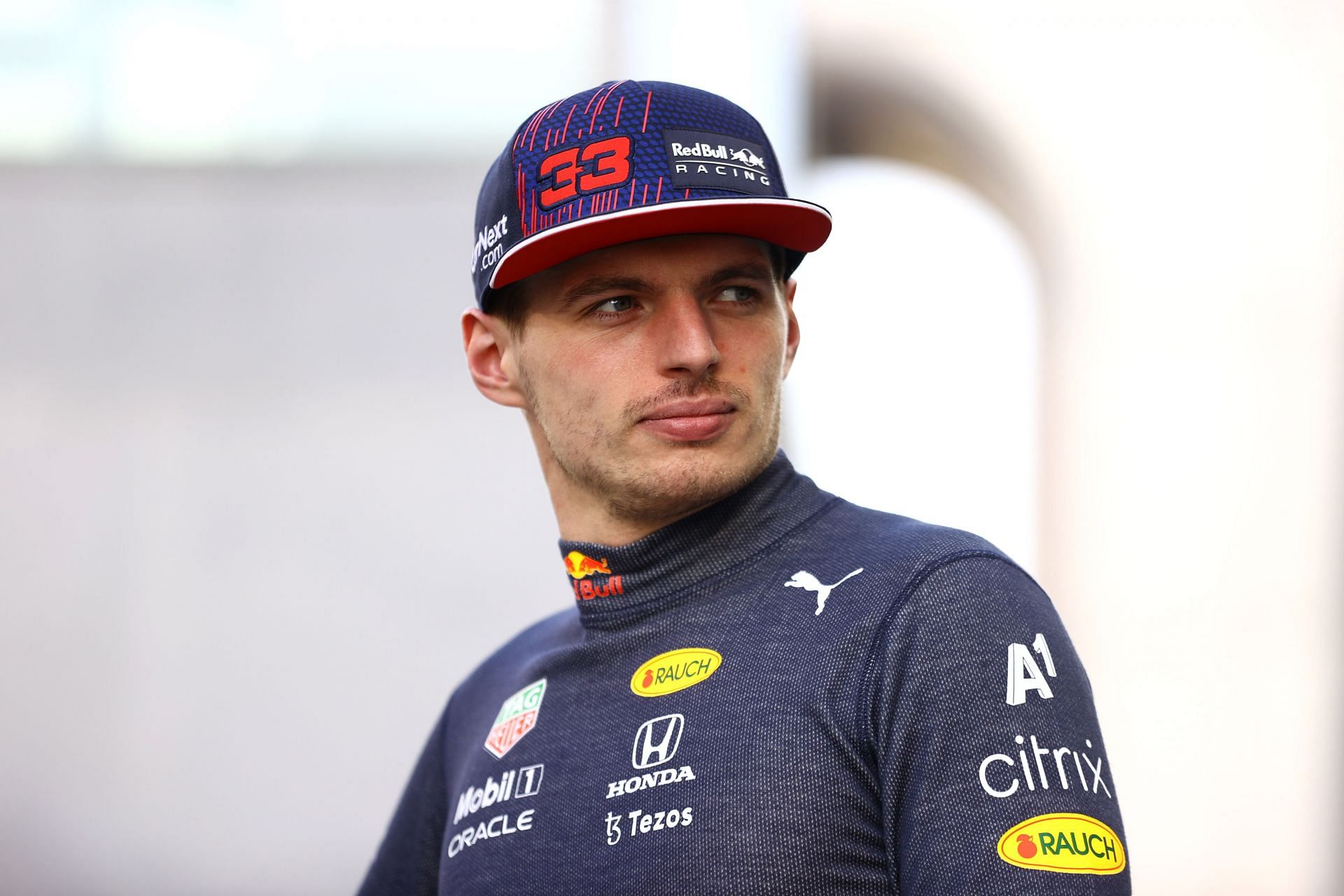 Max Verstappen looks on at the Red Bull Racing team photo during previews ahead of the 2021 Abu Dhabi GP. (Photo by Bryn Lennon/Getty Images)
