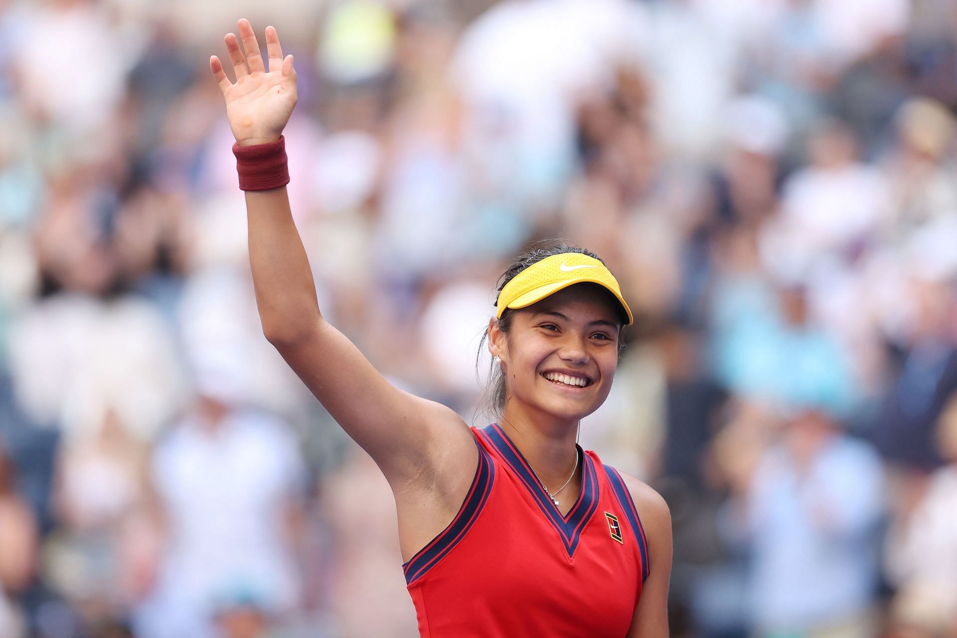 Emma Raducanu waves to the crowd