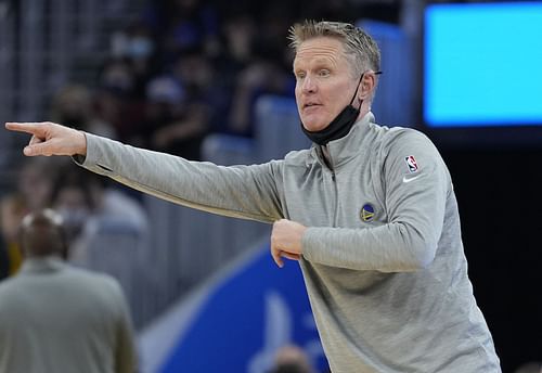 Head coach Steve Kerr of the Golden State Warriors giving directions to his team on the court against the Sacramento Kings during the first half of an NBA basketball game at Chase Center on December 20, 2021 in San Francisco, California.