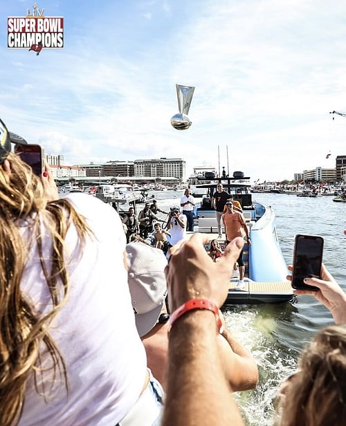 Brady throwing Lombardi Trophy. Credit: @Chrisfischer and Tampa Bay Buccaneers