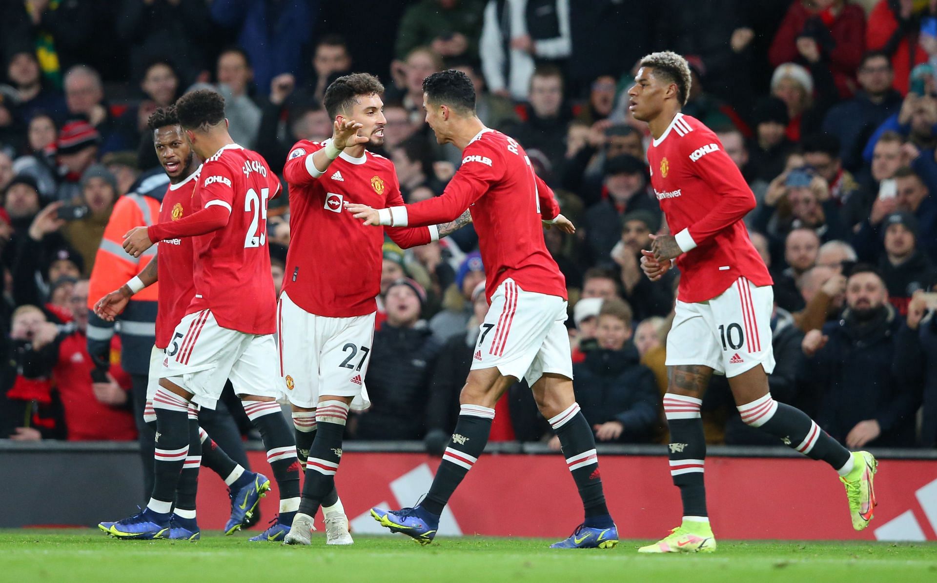Manchester United players celebrate during their game against Arsenal.