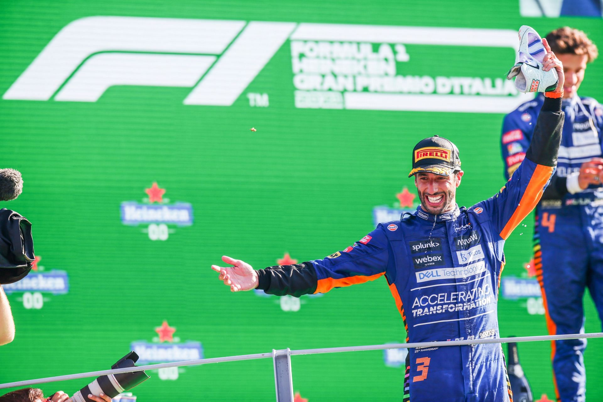 Daniel Ricciardo celebrates with a &quot;shoey&quot; after winning the 2021 Italian Grand Prix