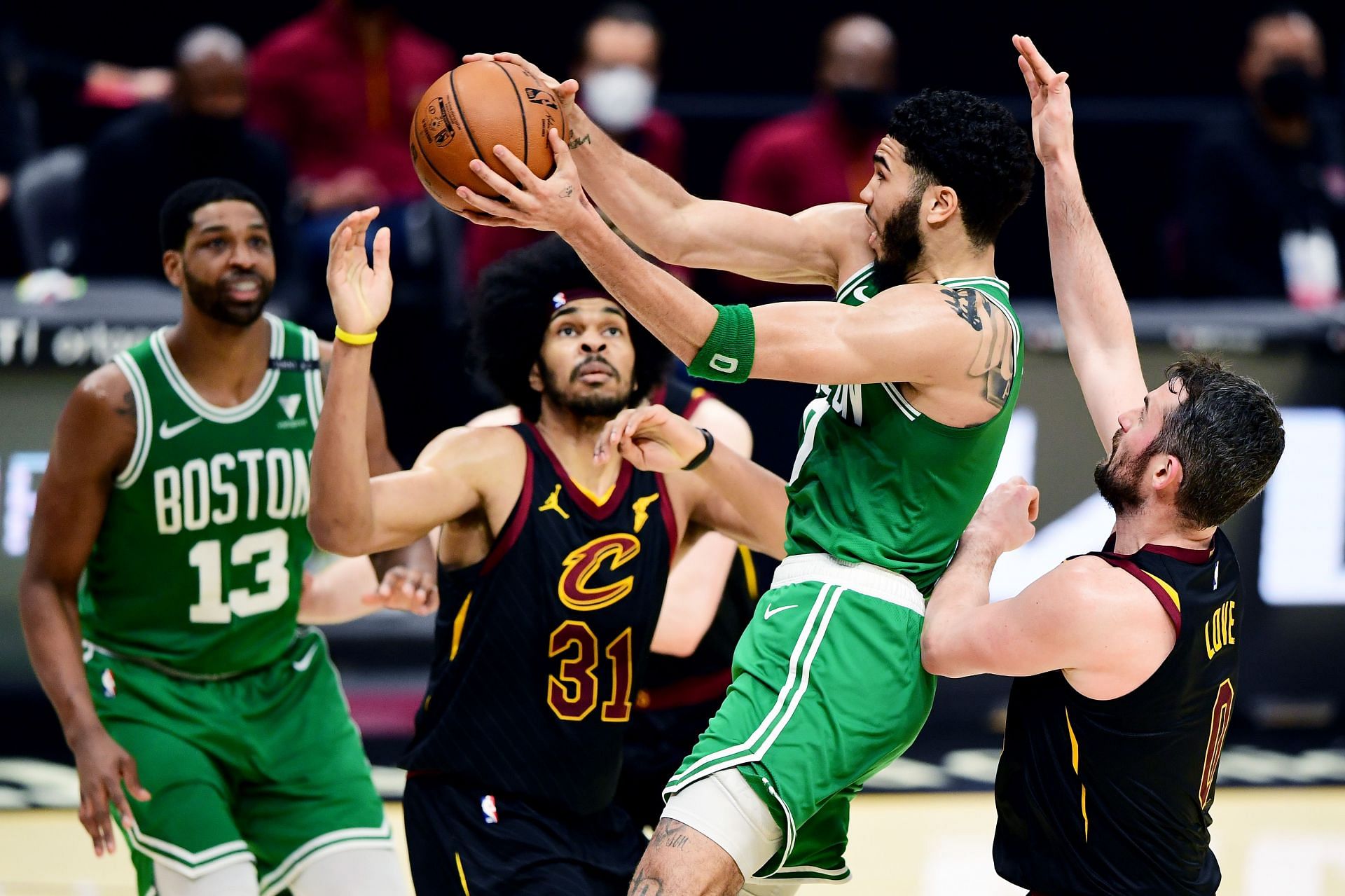 Jayson Tatum of the Boston Celtics elevates v Jarrett Allen of the Cleveland Cavaliers