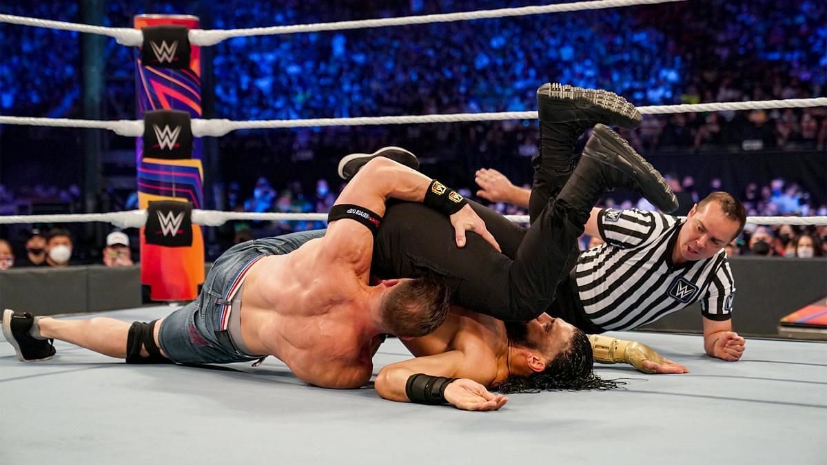 John Cena and Roman Reigns engaged in a heated battle