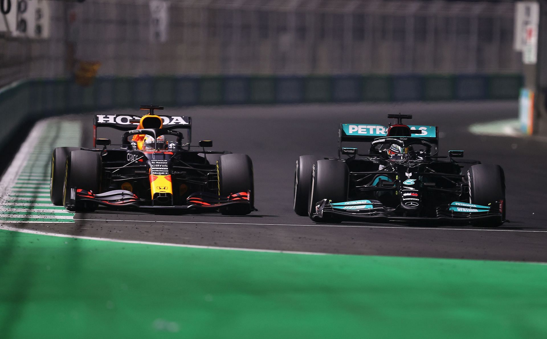 F1 Grand Prix of Saudi Arabia - Lewis Hamilton defends from Max Verstappen heading into a left-hander.