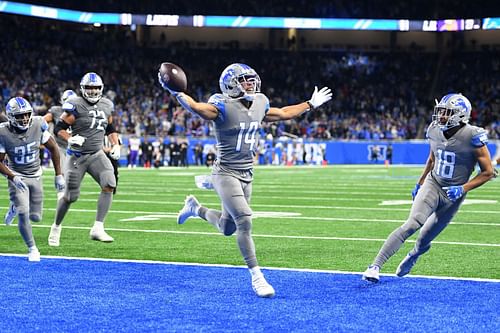 Amon-Ra St. Brown (14) celebrates after earning Detroit's fate Sunday score (Photo: Getty)