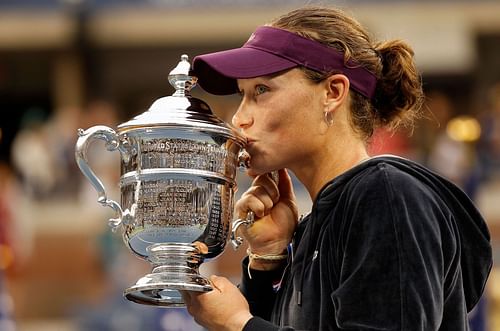 Sam Stosur poses with the 2011 US Open trophy