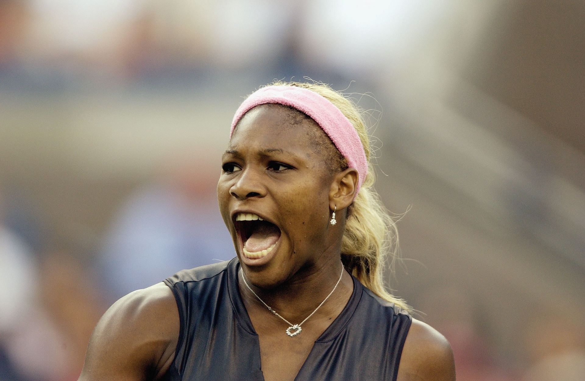 Serena paired her iconic 2002 US Open Puma catsuit with a pink headband.