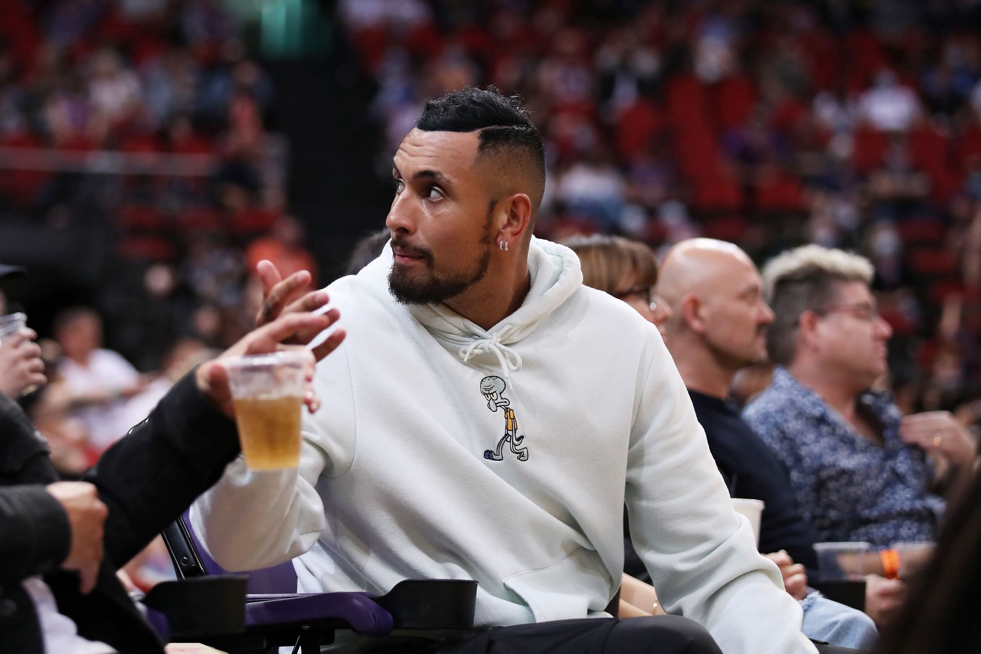 Nick Kyrgios watching an NBL match - Sydney v Illawarra