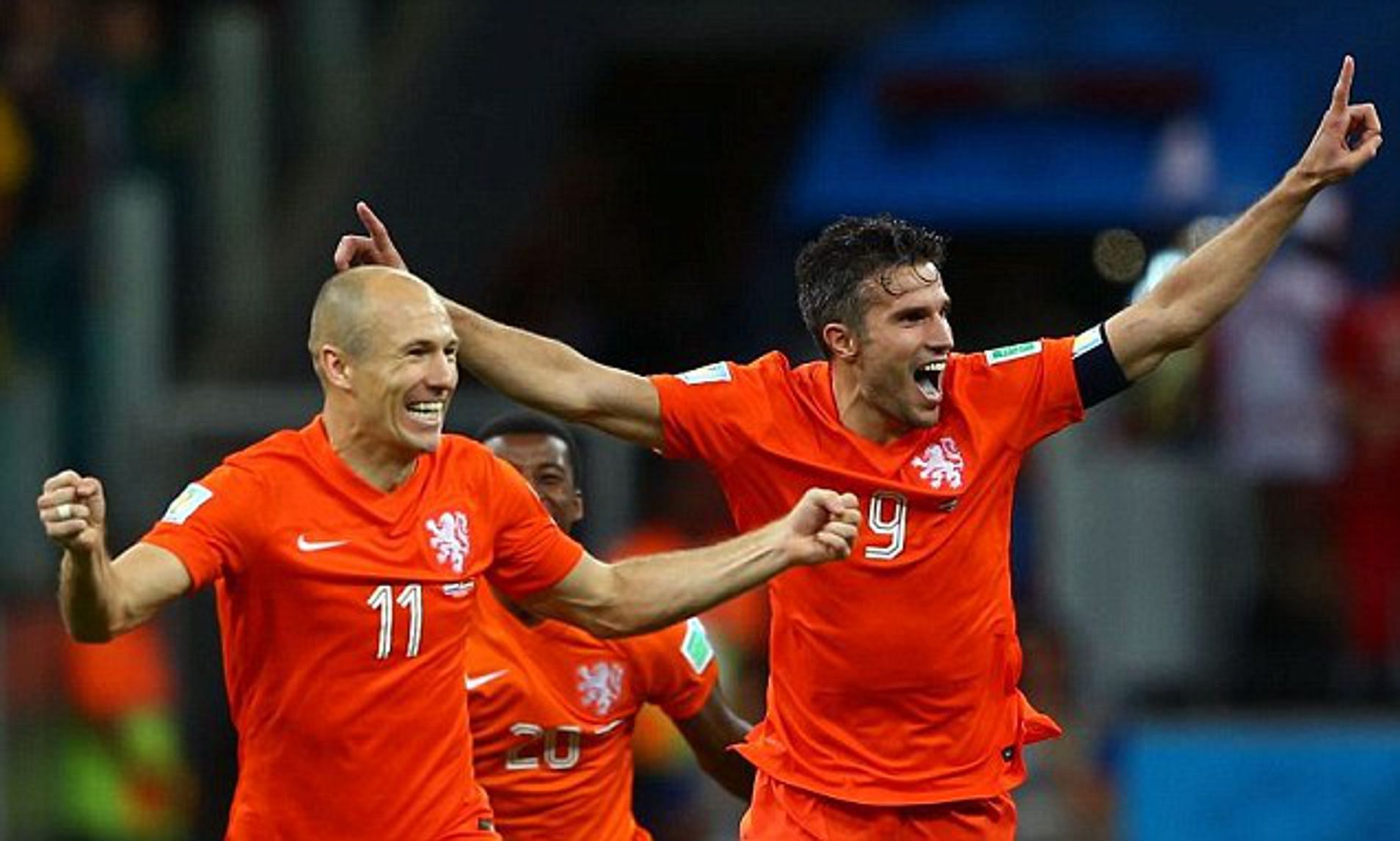 Arjen Robben and Robin van Persie celebrate a goal for the Netherlands.