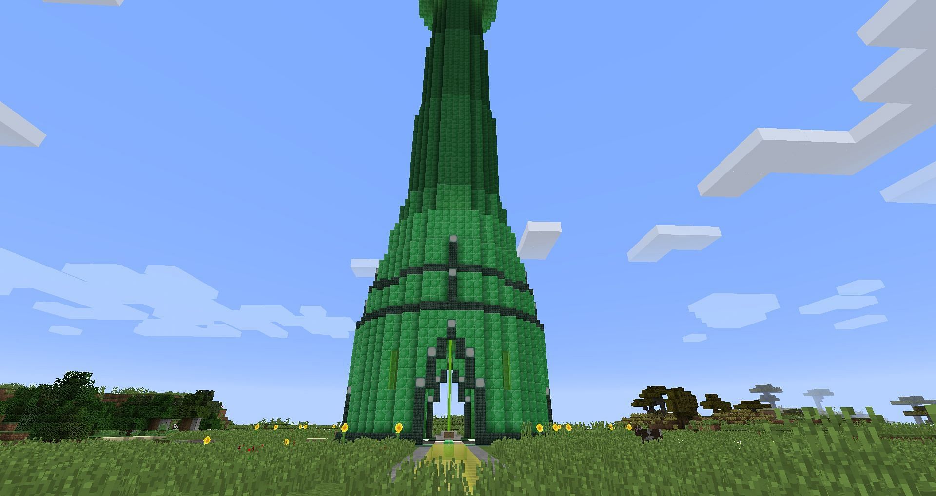 A huge emerald tower marks a world&#039;s spawn point (Image via Mojang)