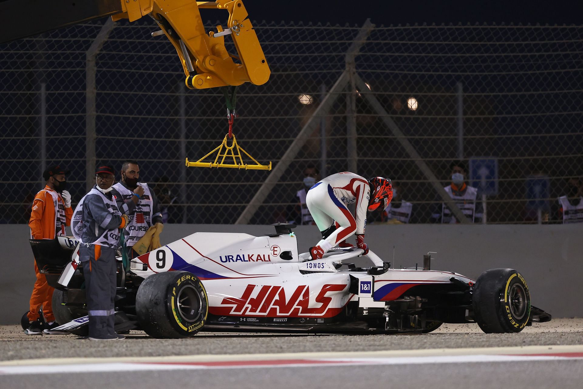 Nikita Mazepin emerges from his Haas after a crash in Bahrain (Photo by Lars Baron/Getty Images)