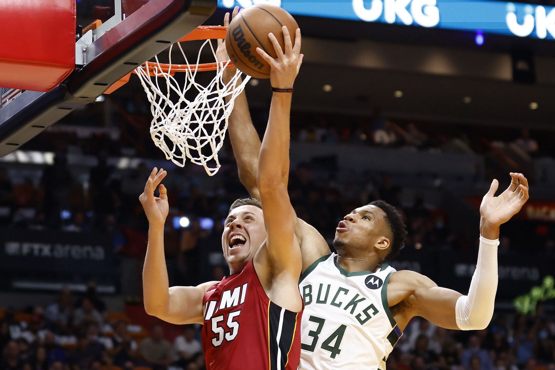 Giannis Antetokounmpo of the Milwaukee Bucks blocks Duncan Robinson of the Miami Heat.