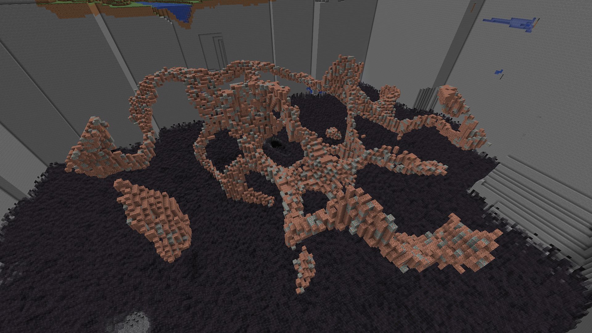 A copper ore vein surrounded by granite blocks (Image via Minecraft Wiki)