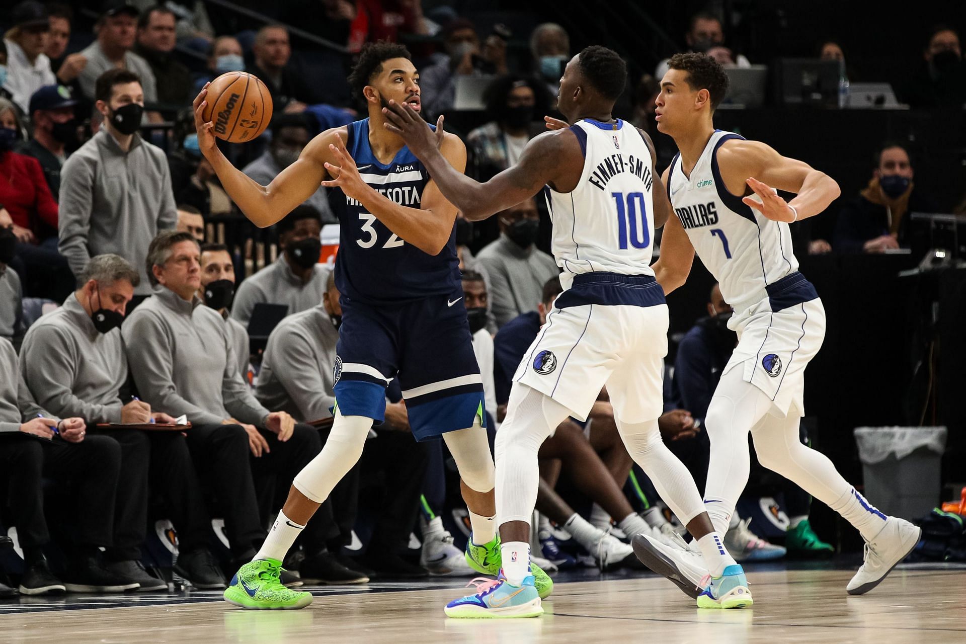 Karl-Anthony Towns of the Minnesota Timberwolves guarded by Dorian Finney-Smith of the Dallas Mavericks.
