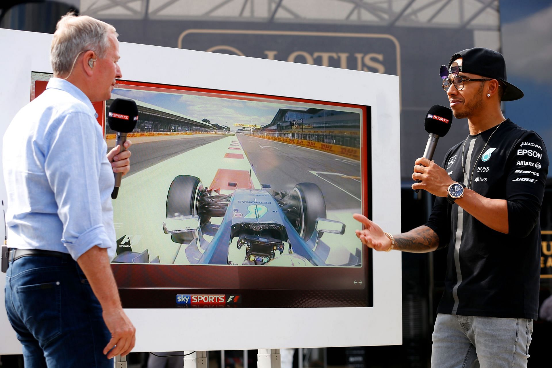 Martin Brundle (left) and Lewis Hamilton (right) at the 2015 British Grand Prix. (Photo by Charles Coates/Getty Images)