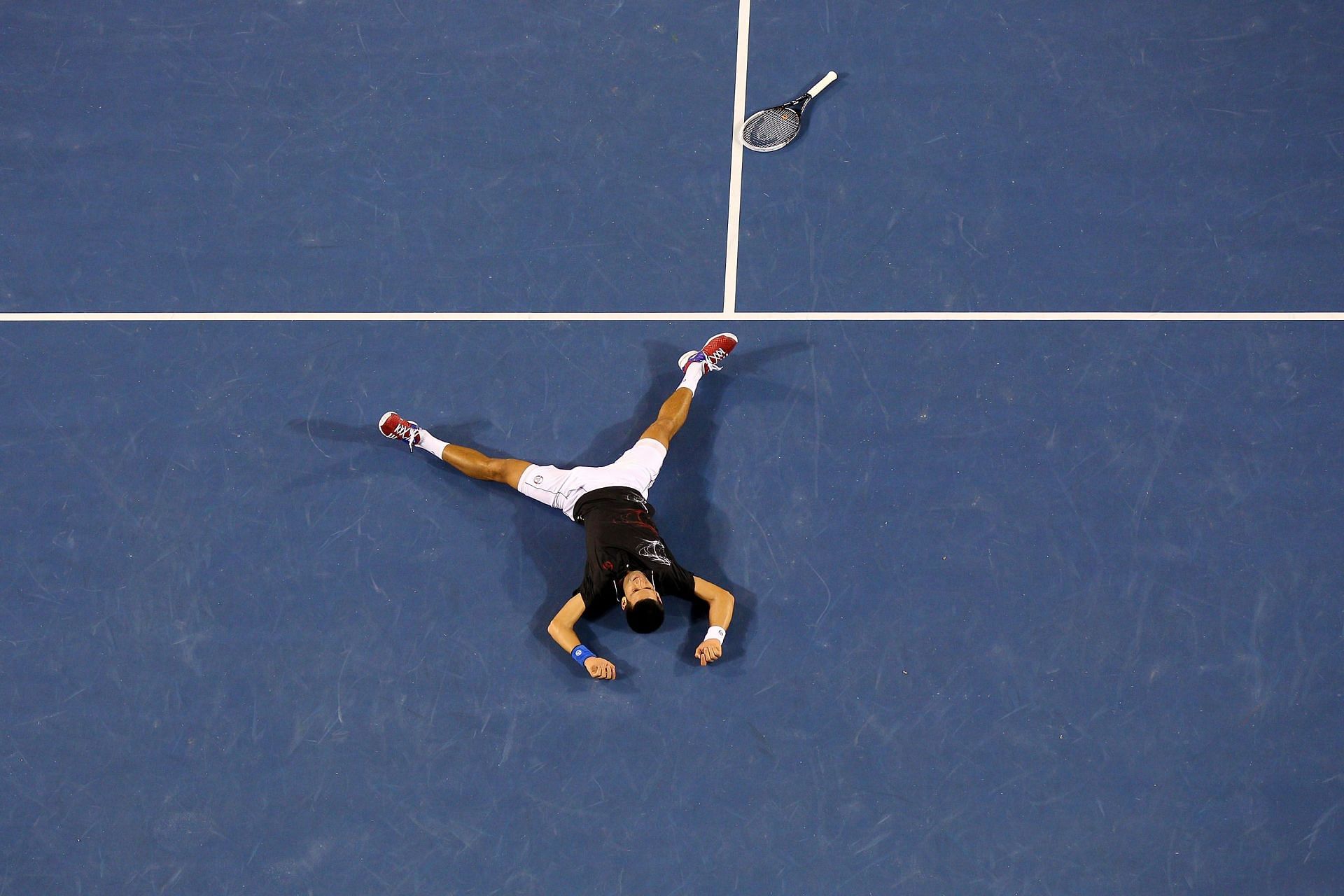 Novak Djokovic celebrates after beating Rafael Nadal in the 2012 Australian Open final
