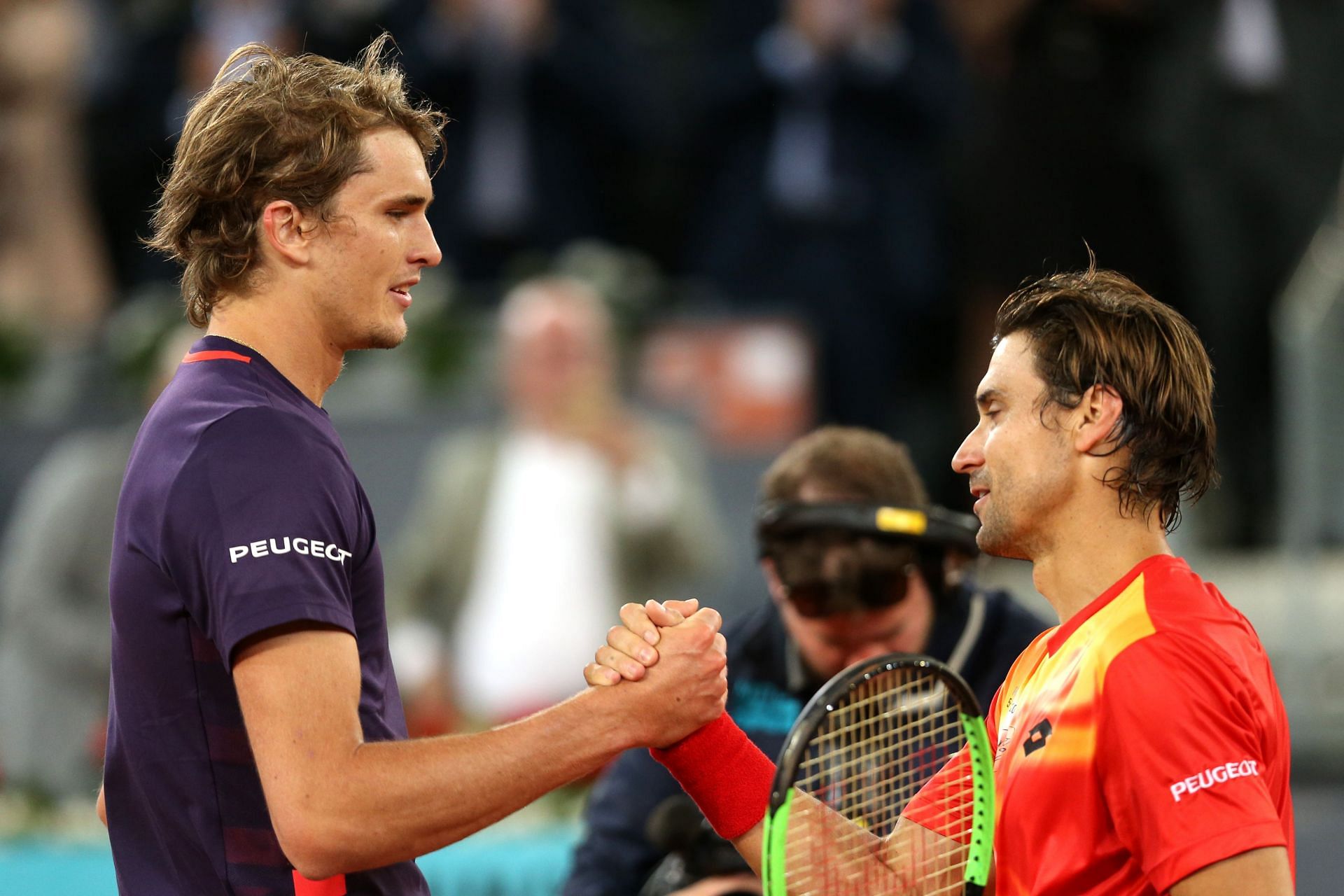 Alexander Zverev (L) and David Ferrer shake hands after the latter&#039;s last-ever match at the 2019 Mutua Madrid Open