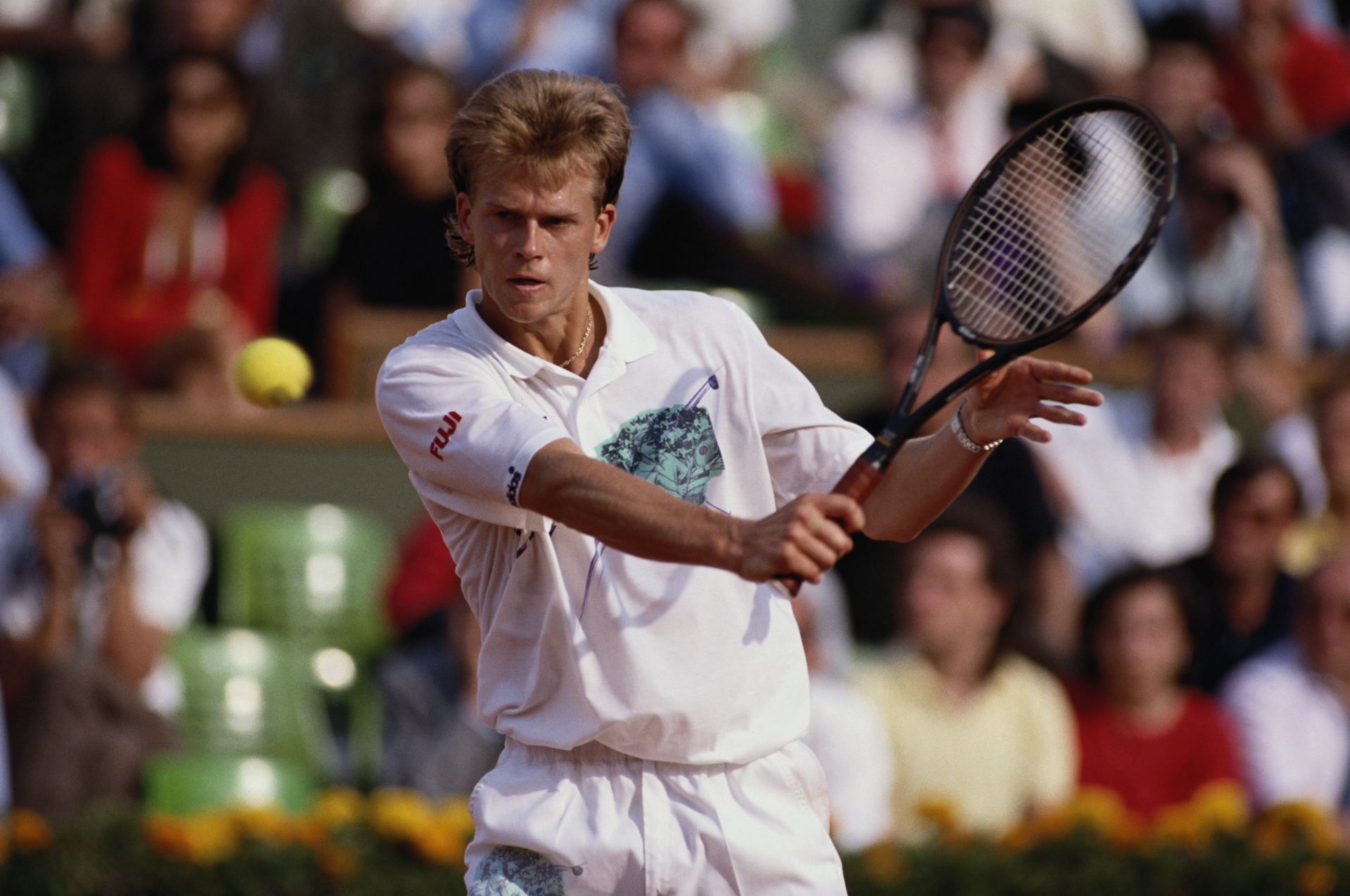 Stefan Edberg plays a backhand volley in a match against Sergi Bruguera at the 1990 French Open