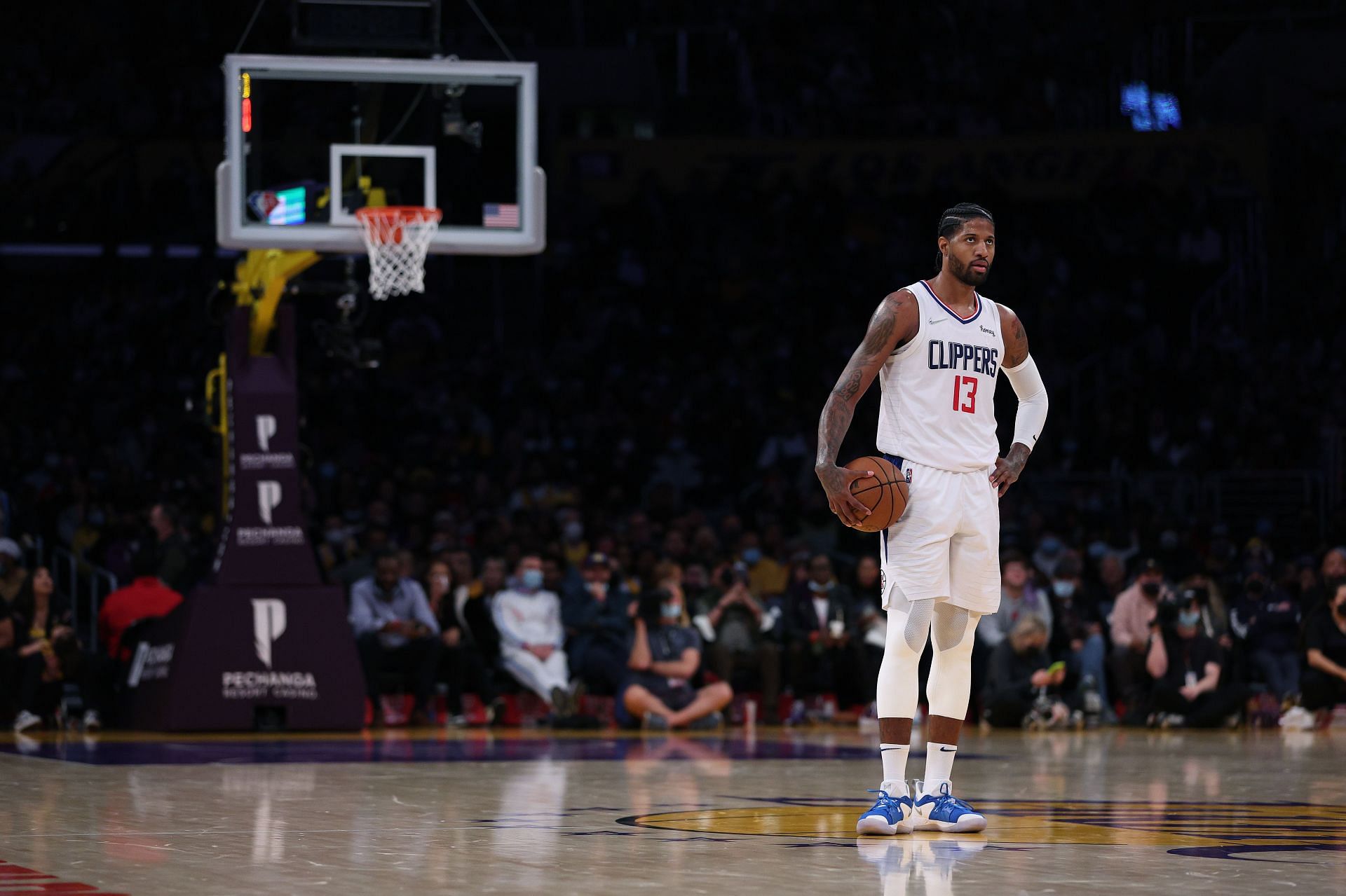 Paul George looks on at the LA Clippers vs LA Lakers game