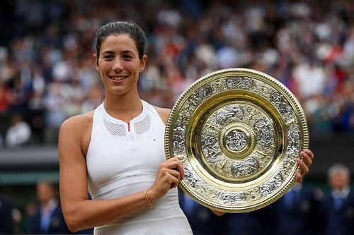 Garbine Muguruza celebrates with the trophy after winning Wimbledon in 2017