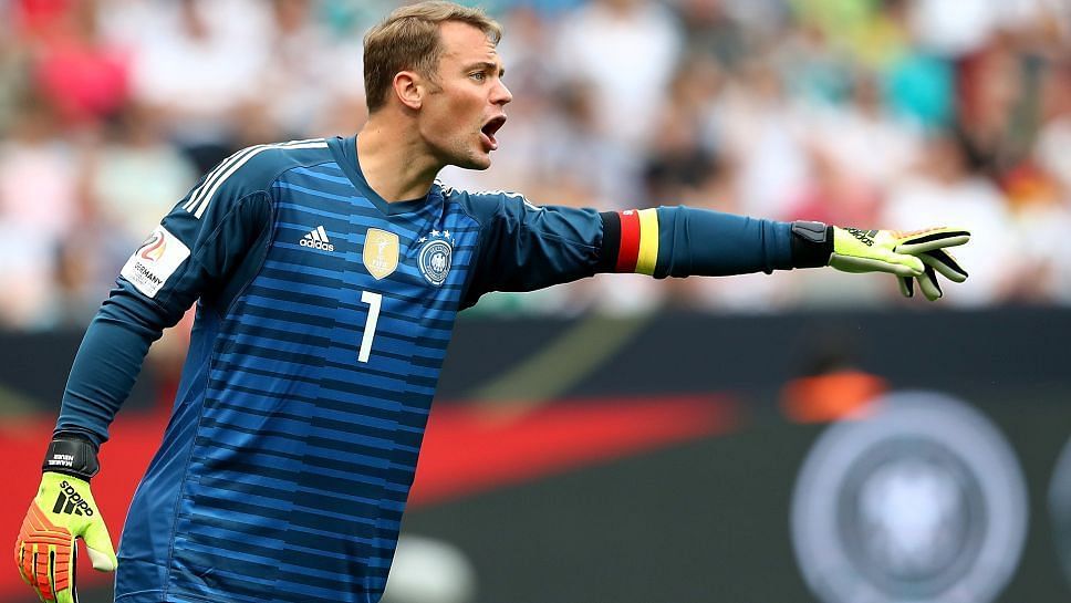 Manuel Neuer shouting instructions at defenders during a game for Germany