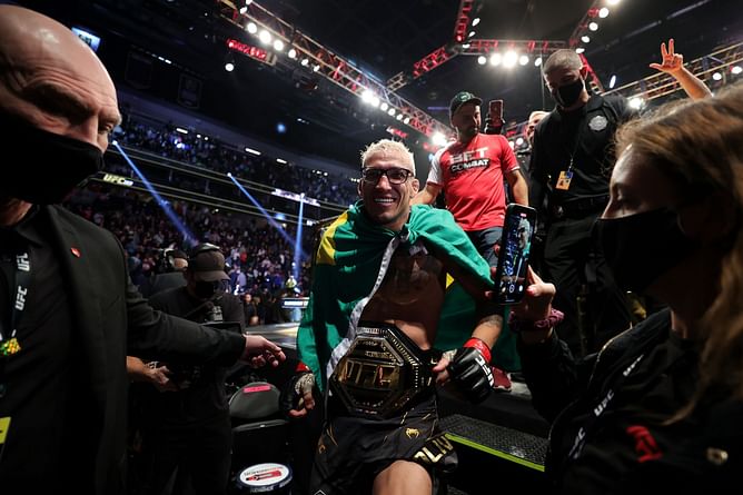Watch: Fan in the crowd snatches Charles Oliveira's glasses at UFC 269