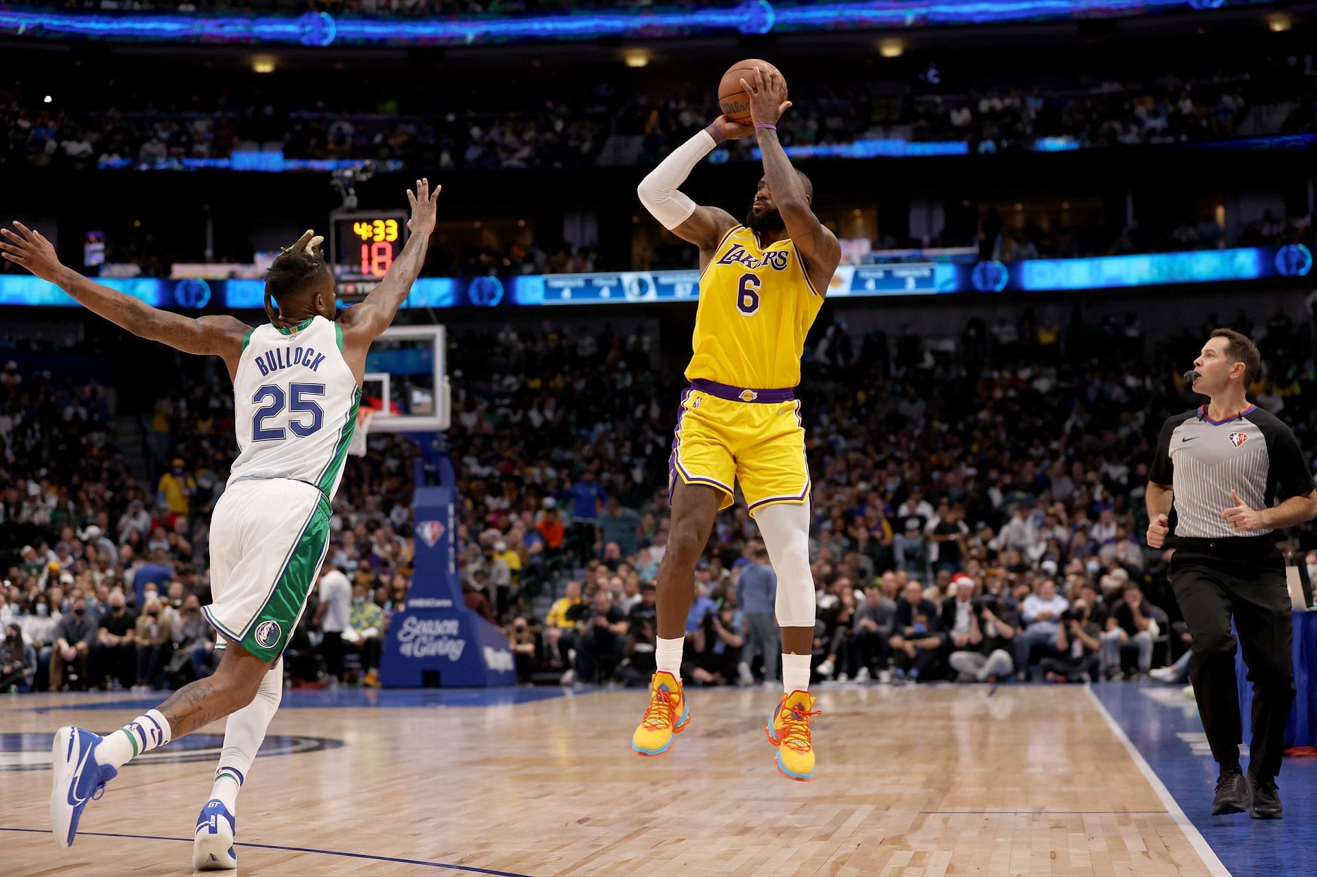 LeBron James of the Los Angeles Lakers shoots against Reggie Bullock of the Dallas Mavericks.