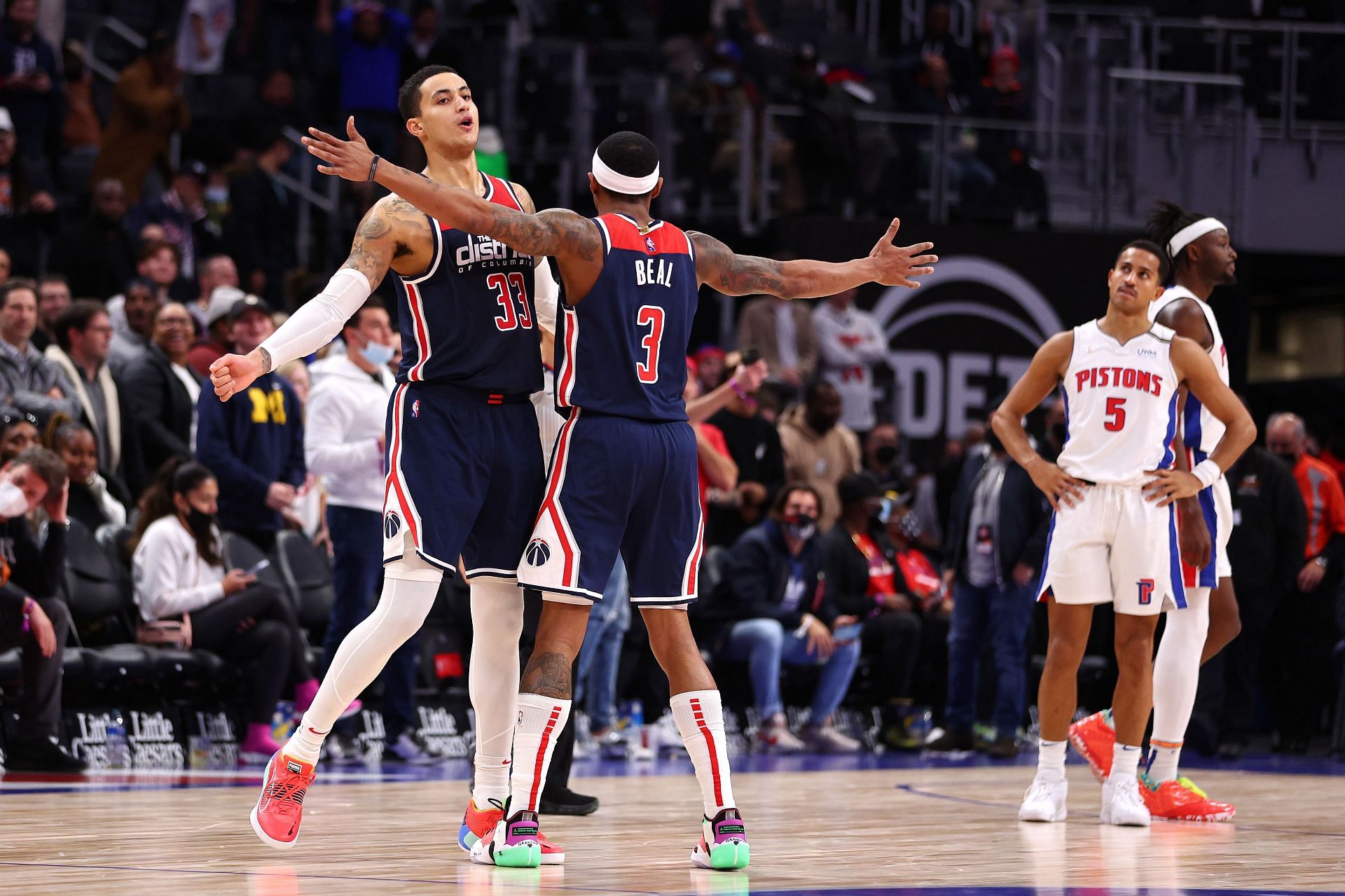 Kyle Kuzma #33 of the Washington Wizards celebrates a three point basket with Bradley Beal #3