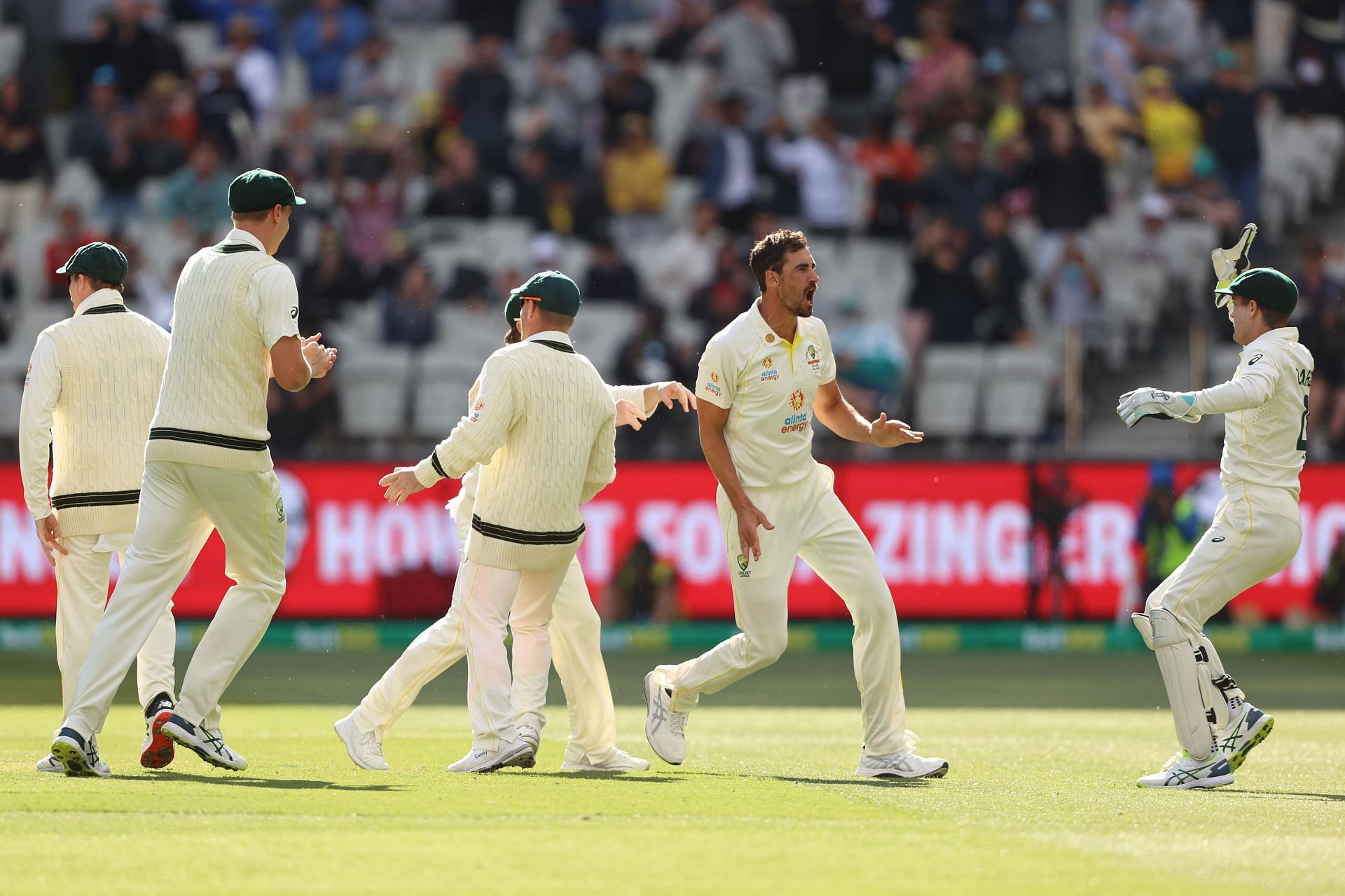 Mitchell Starc celebrates with teammates after dismissing Dawid Malan. Pic: Getty Images