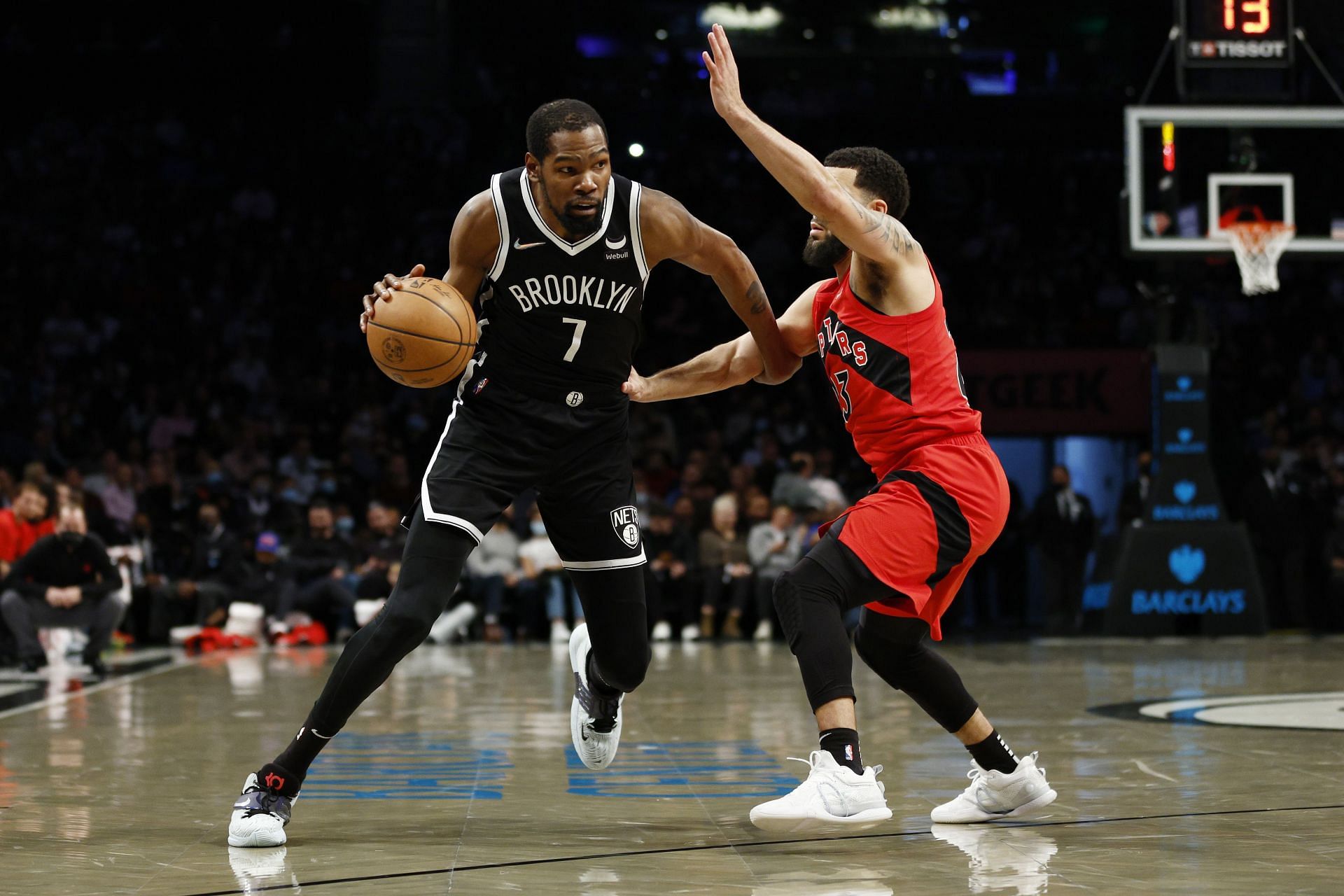 Kevin Durant of the Brooklyn Nets dribbles as Fred VanVleet of the Toronto Raptors defends during the first half at Barclays Center on Dec. 14, 2021, in the Brooklyn borough of New York City.