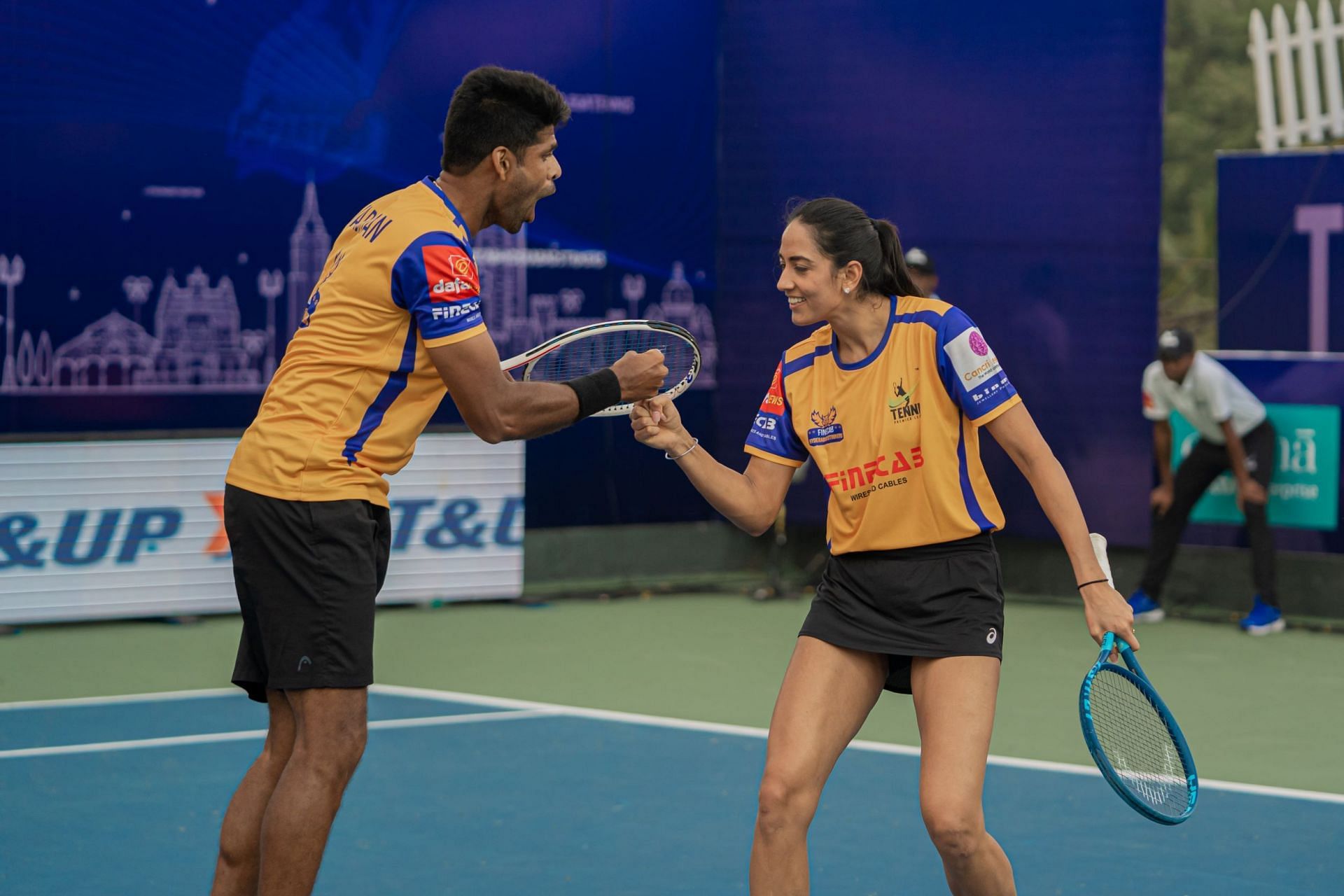 Vishnu Vardhan (L) and Karman Kaur in mixed doubles action