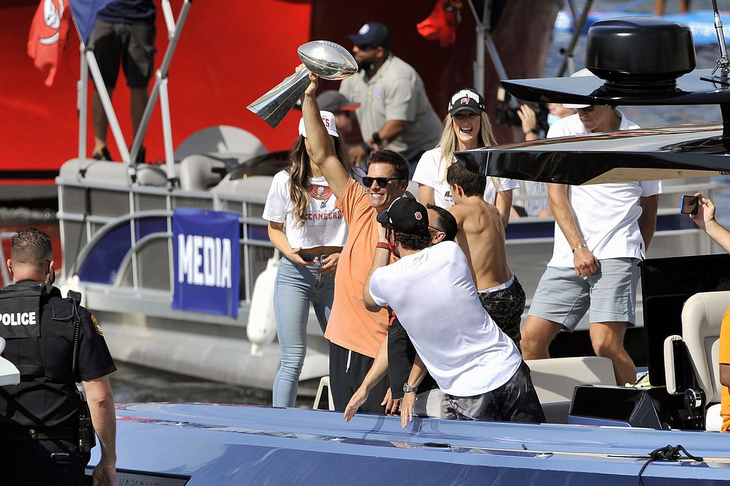 Tom Brady Tosses Lombardi Trophy Off Boat At Super Bowl Parade, It's Caught!