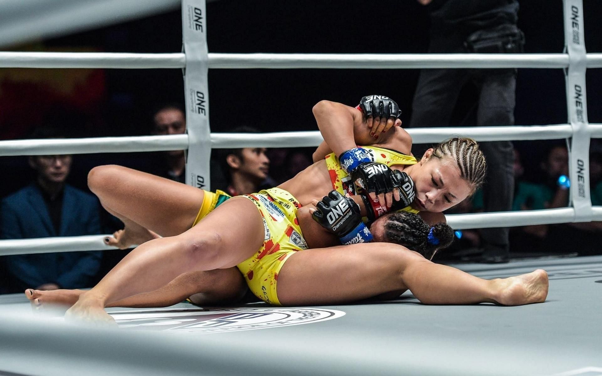 ONE Championship strawweight submission artist Ayaka Miura (top) uses the scarf-hold pin to score the most submissions in ONE strawweight history. (Image courtesy of ONE Championship)