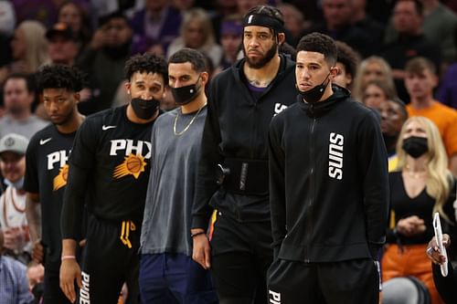 Devin Booker (right) will remain sidelined for the Phoenix Suns' match against Washington Wizards.