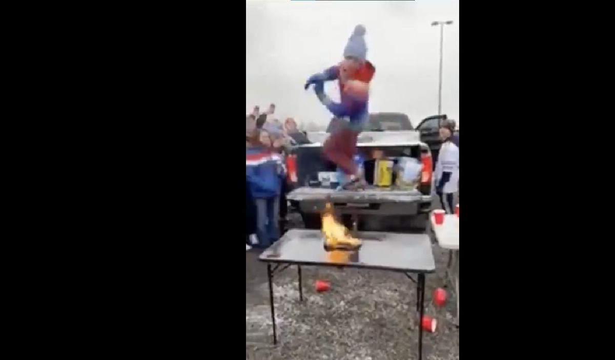 Watch Bills fan takes pregame ritual to next level by jumping on to