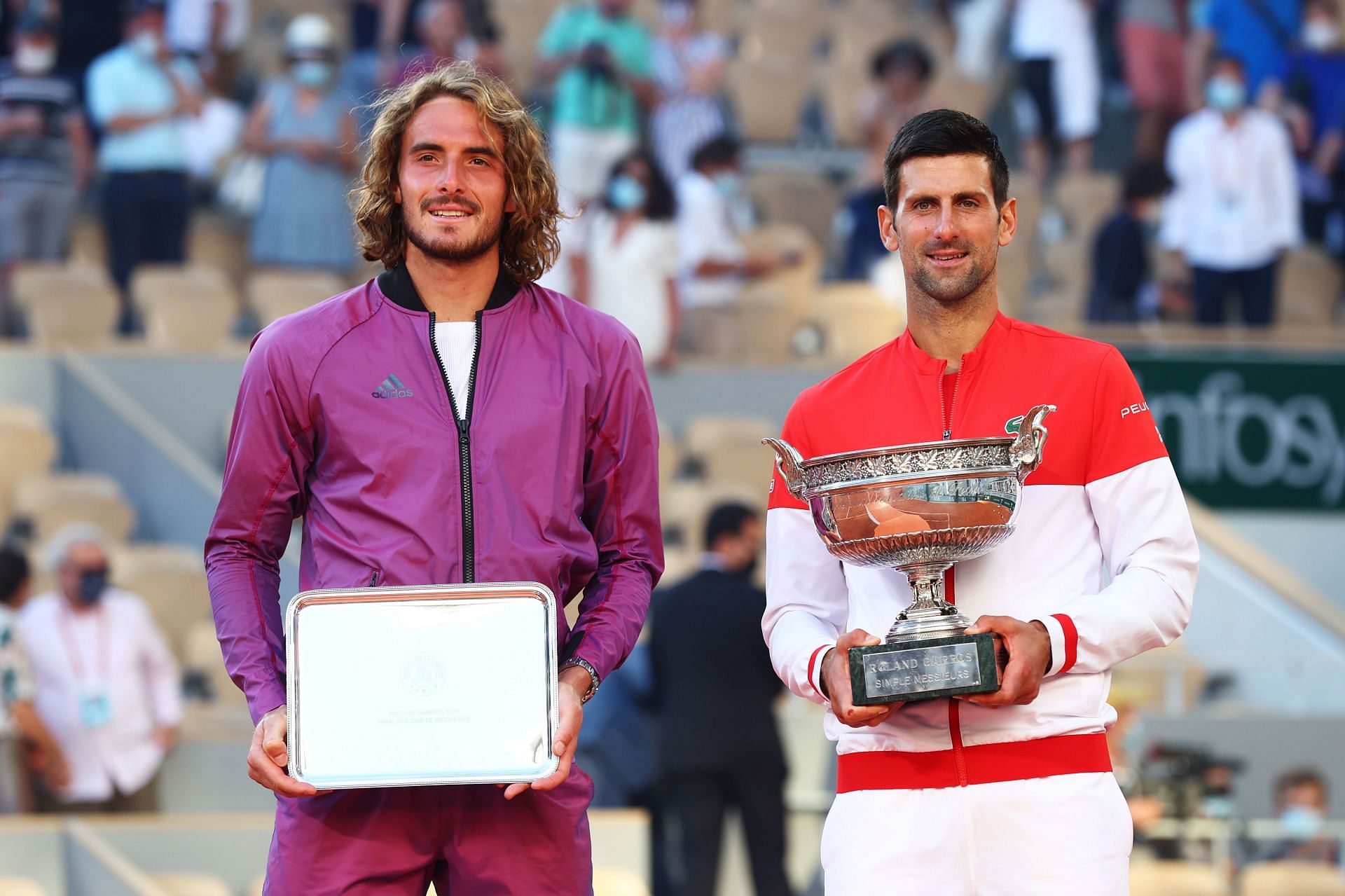 Stefanos Tsitsipas and Novak Djokovic after the 2021 French Open final