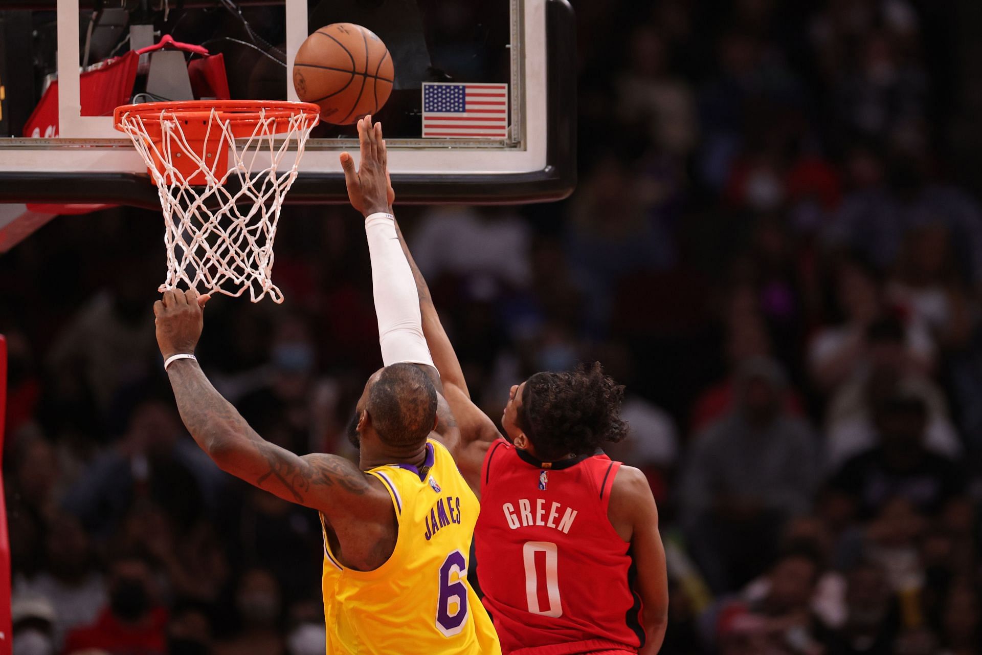 Los Angeles Lakers center LeBron James defends a shot from Jalen Green of the Houston Rockets