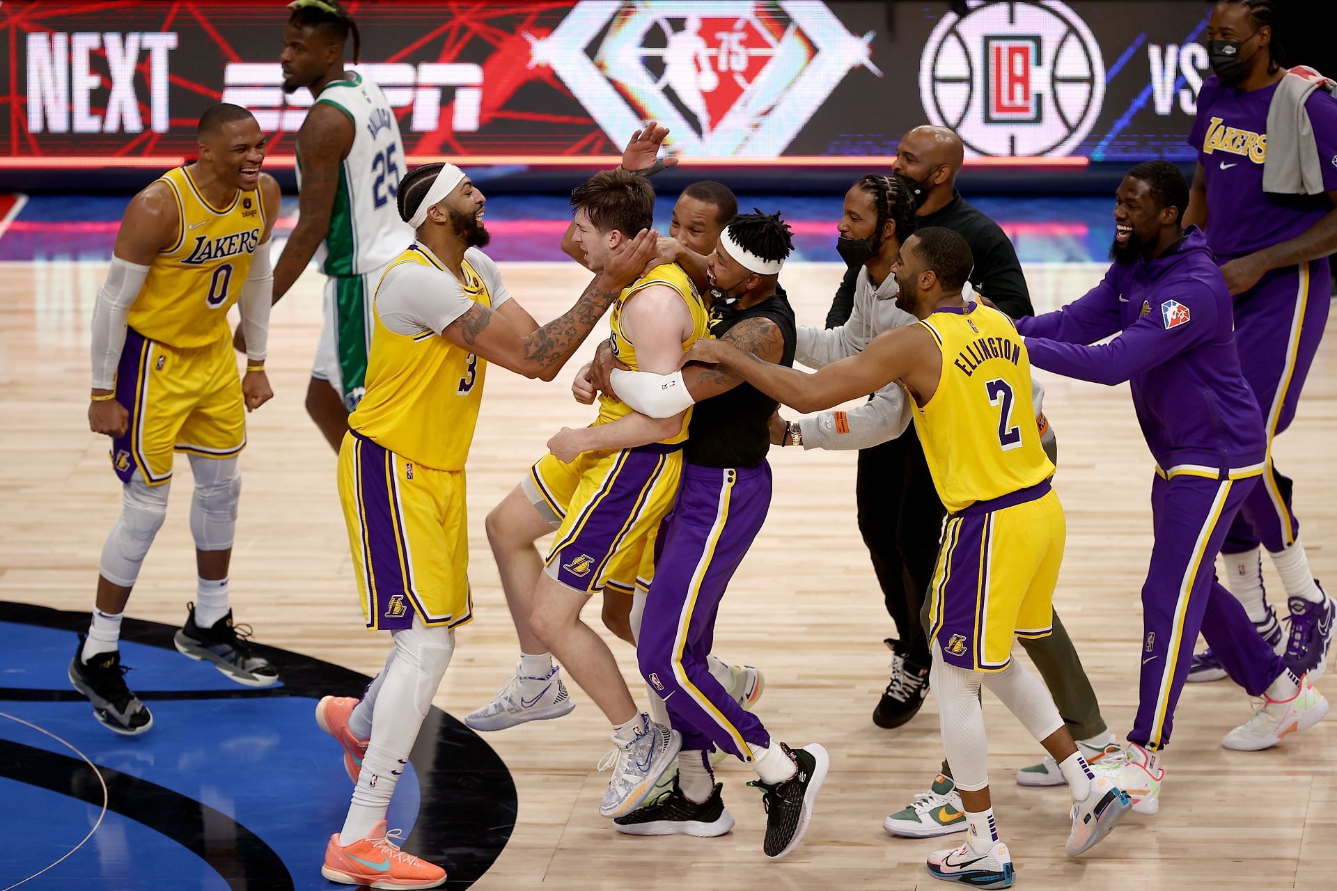 Austin Reaves #15 of the Los Angeles Lakers reacts after shooting the game-winning shot