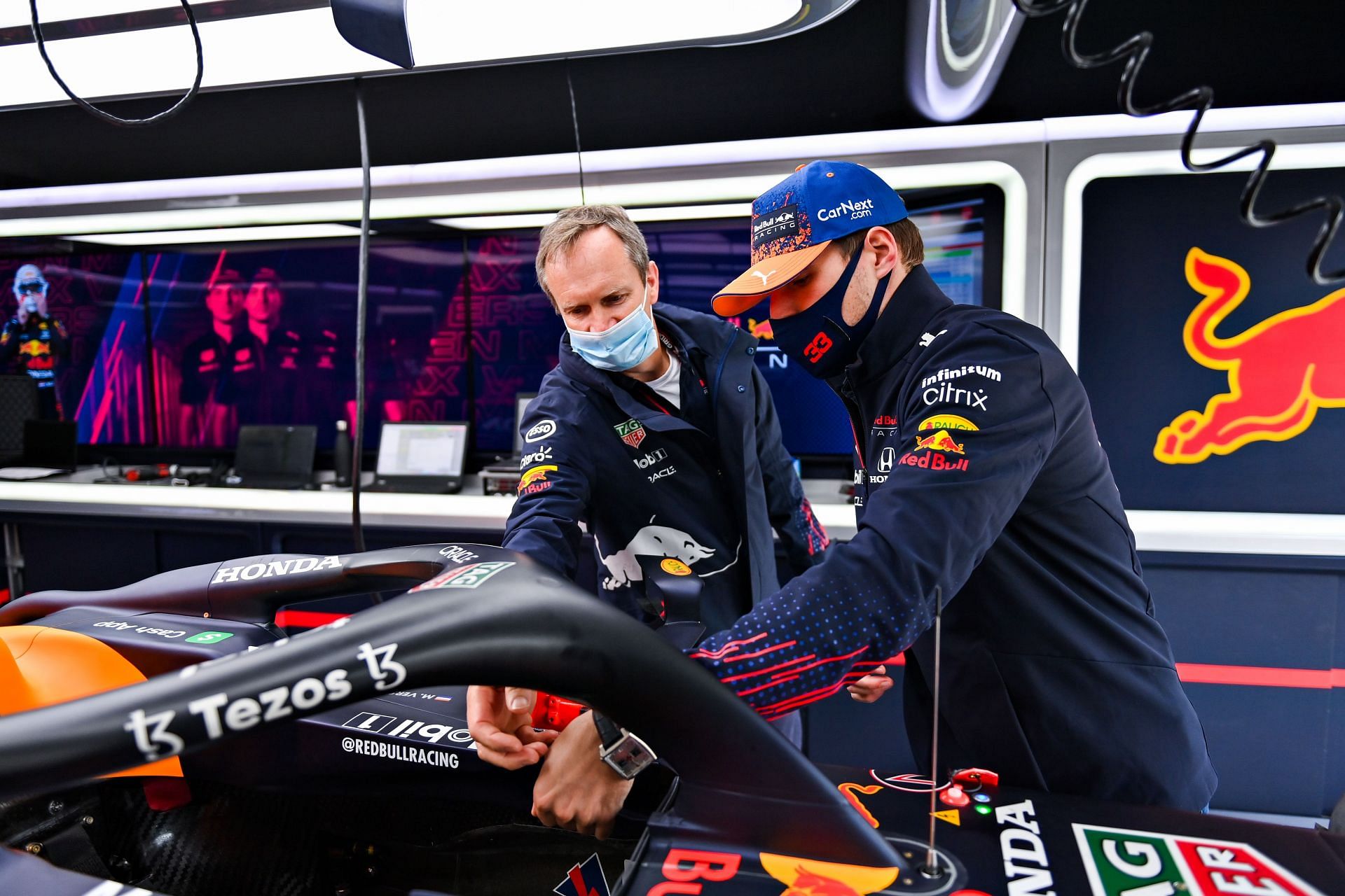 Max Verstappen and Red Bull Racing Head of Car Engineering Paul Monaghan in the garage.
