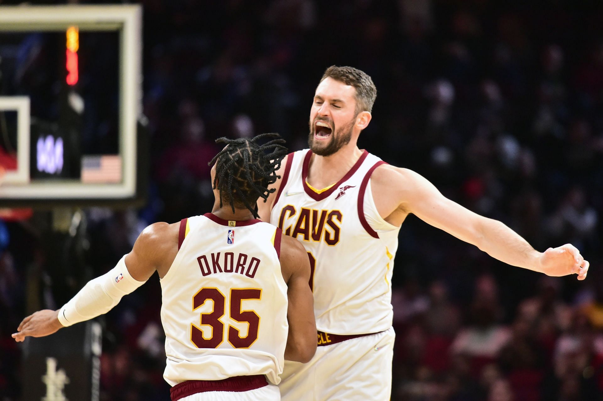 Isaac Okoro and Kevin Love of the Cleveland Cavaliers celebrate their win