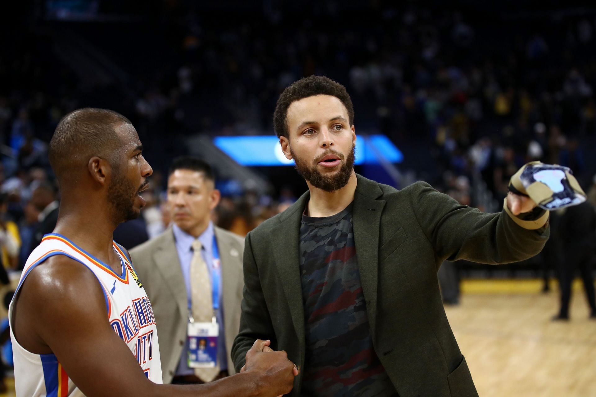 Chris Paul and Stephen Curry interact during an NBA game