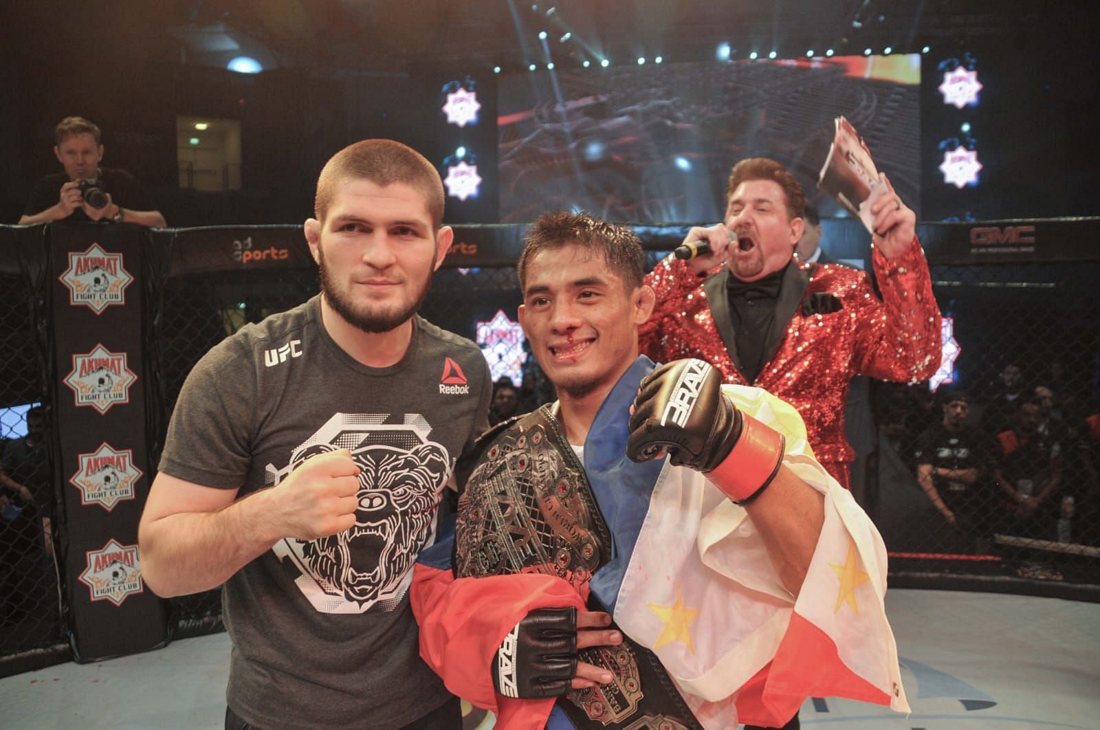 Stephen Loman gets presented his Brave CF championship belt by Khabib Nurmagomedov | Photo: Brave CF