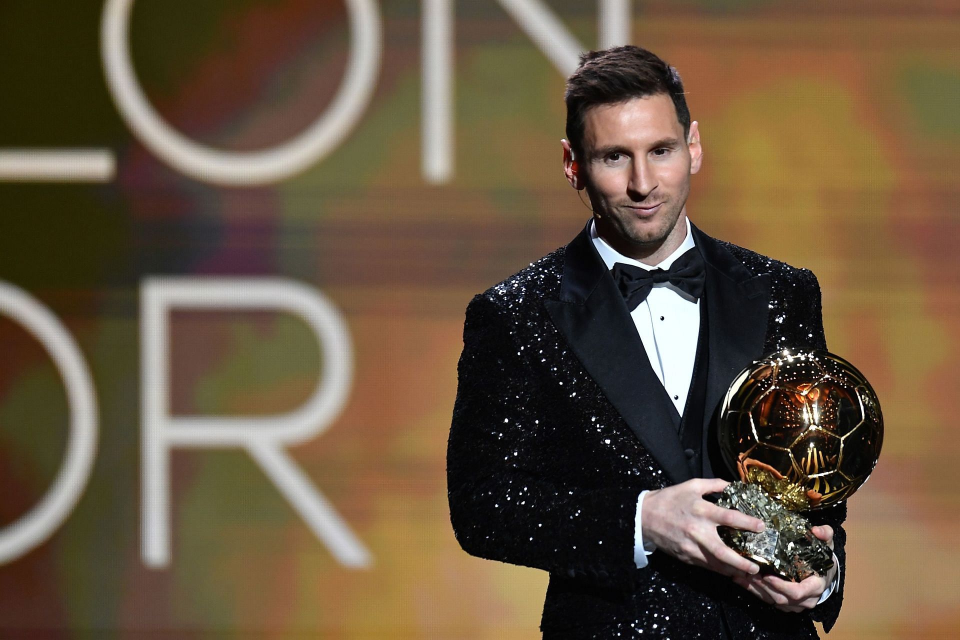 Lionel Messi holding up his seventh Ballon d'Or award