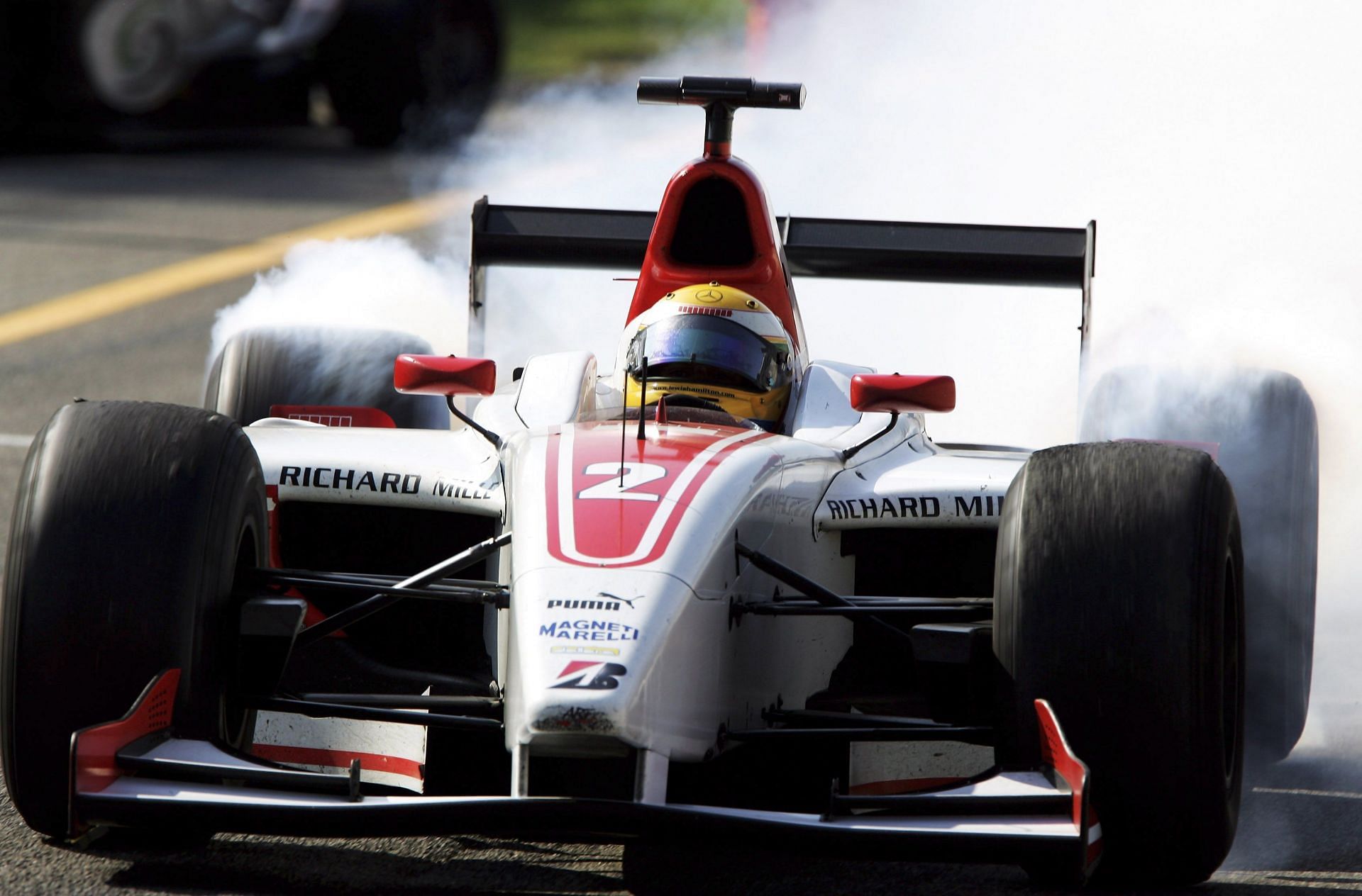 Italian F1 Grand Prix - GP2 - Lewis Hamilton celebrates after winning the season.