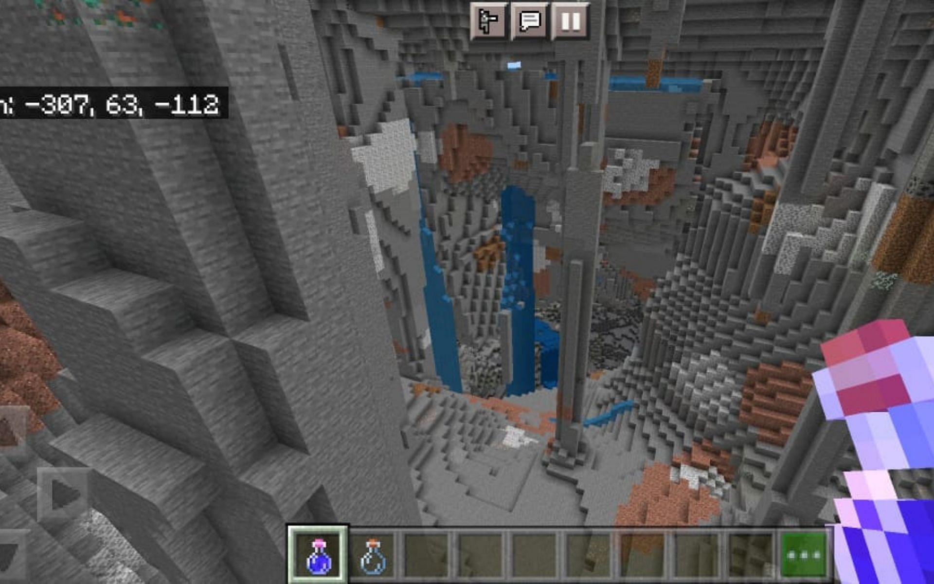 A massive cave within a snow capped mountain (Image via Minecraft)