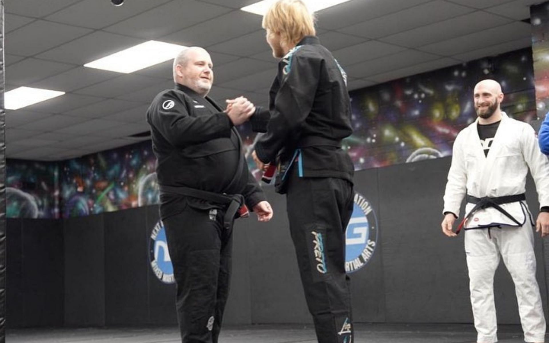 Paddy Pimblett receiving his first degree black from his coach at Next Generation UK. Credits: @paddythebaddyufc on Instagram