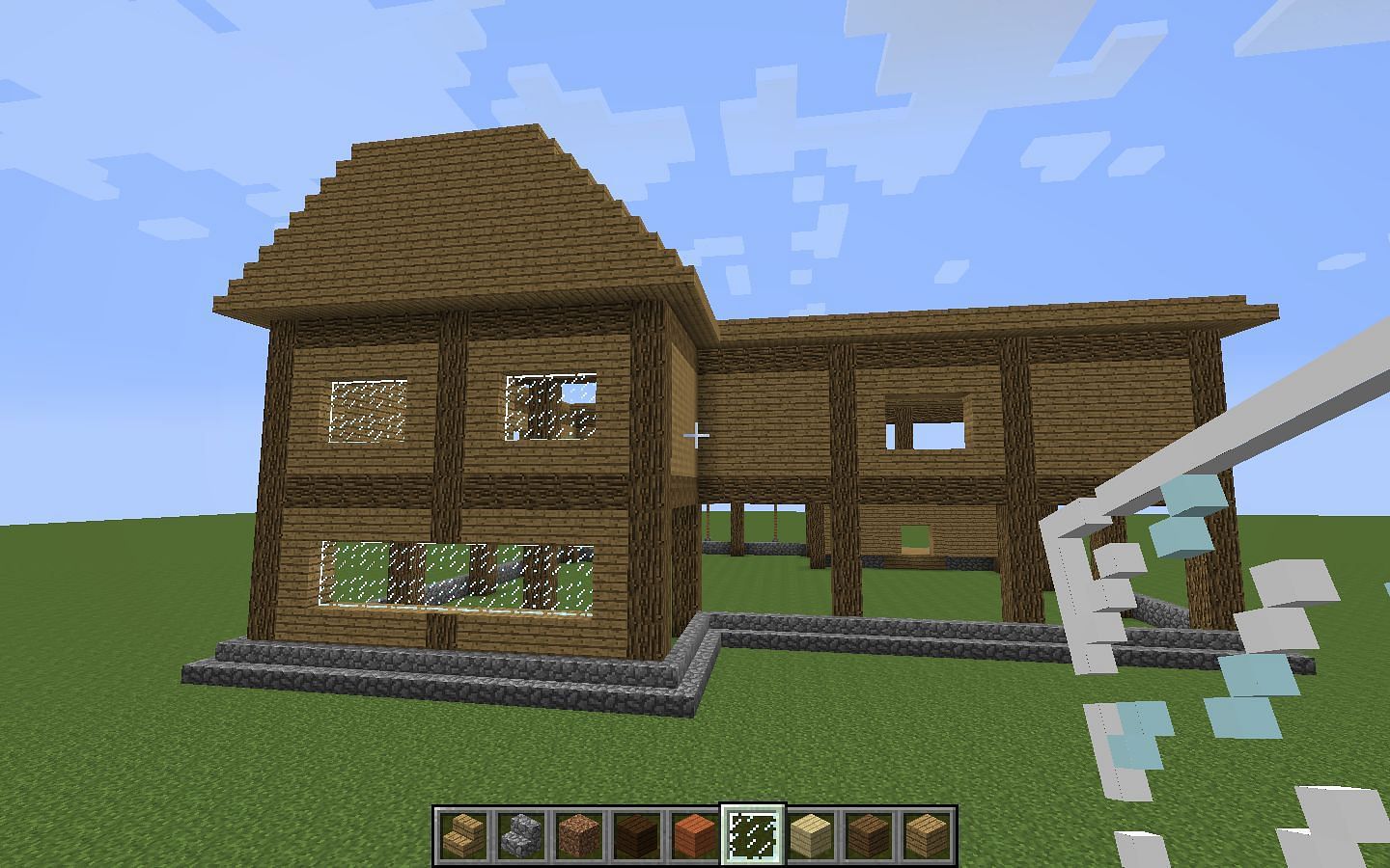 Oak and cobblestone house (Image via Mojang)